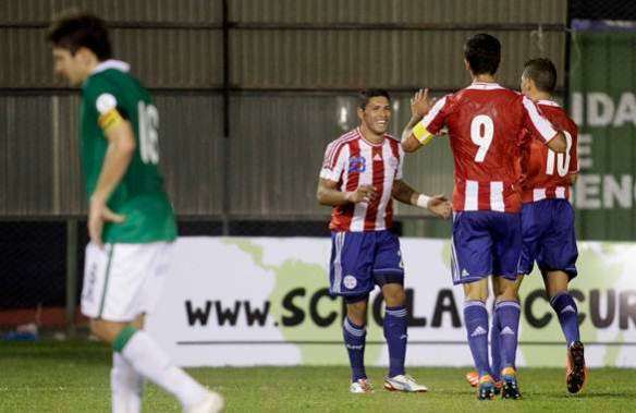 Paraguay's Richard Ortiz celebrates with teammates after scoring against Bolivia in their 2014 World Cup qualifying soccer match in Asuncion